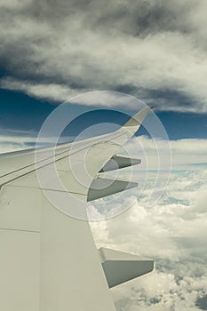 Airline wing over the clouds