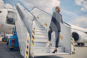 Airline worker holding on to the handrail