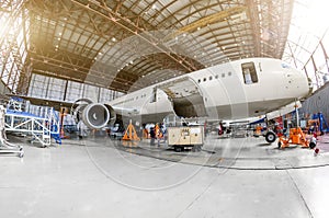 Airliner aircraft in a hangar to the service.