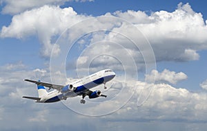 Airliner In Cloudy Sky