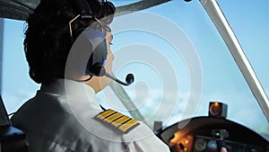 Airliner crew commander navigating plane in blue sky, passenger transportation