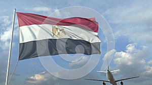 Airliner flying over waving flag of Egypt. 3D rendering