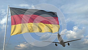 Airliner flying over waving flag of Germany. 3D animation