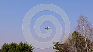 Airliner with passengers on the blue sky. The plane flies in the sky. The plane takes off against a clear sky.