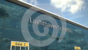 Landing airplane reflects in the modern windows with Luchthaven Schiphol or Airport Schiphol text. 3d rendering photo