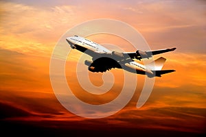 Airliner taking off at sunset photo