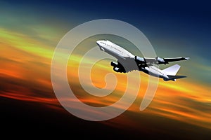 Airliner taking off at sunset