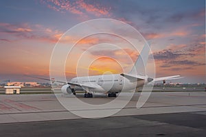 Airliners jet plane rear view of the wings and tail during a bright dawn of beautiful sky.