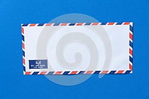 Airmail envelope on blue background