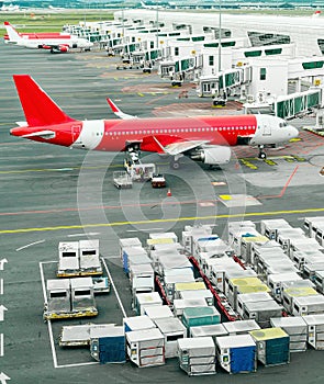 Airplains and freight containers in airport