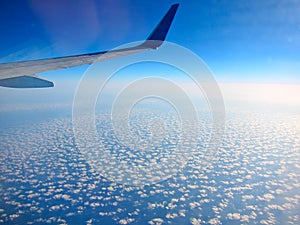 Airplane above clouds