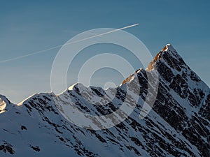 Airplane above Tuxer Joch peak