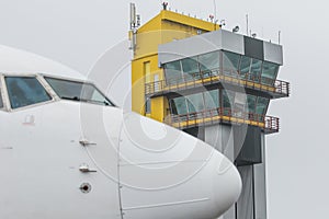 Airplane and air traffic control tower