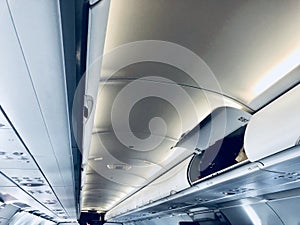 Airplane aisle with overhead compartment