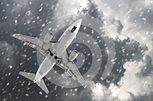 Airplane approaching on a landing in bad snow weather.