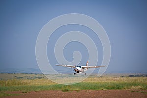Airplane arrive to Masai Mara Reserve photo