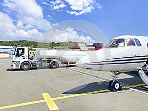 Airplane being fueled with jet fuel photo