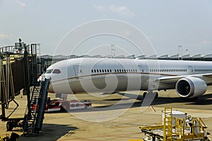 Airplane being preparing ready for takeoff in international airport at travel around the world front view of landed airplane