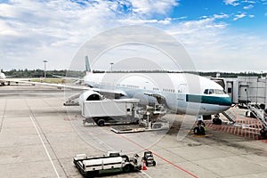 Airplane Being Serviced at the Gate of an International Airport