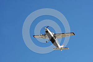 Airplane belly in blue sky