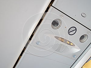 Signs in aircraft cabin for passengers.