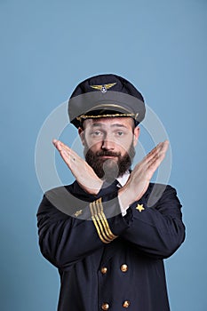 Airplane capitan showing time out gesture with hands