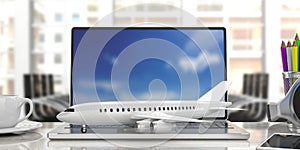 Airplane on a computer keyboard, blur office background. 3d illustration