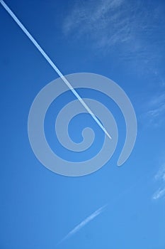Airplane contrail in the sky photo