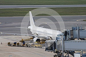 airplane docked airport loading unloading disembarkation boarding