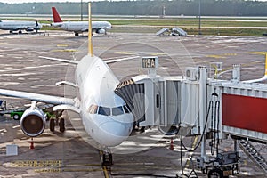 Airplane is docked with gangway to gate of terminal airport