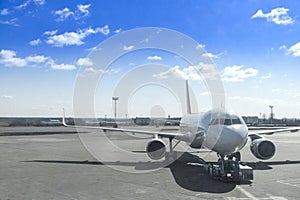 airplane is dragged by car airport and docking in international photo