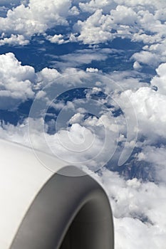 Airplane engine above clouds