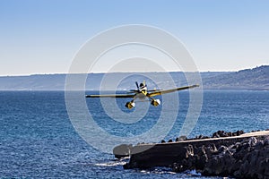 Airplane flies close to the sea