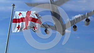 Airplane flies over waving flag of Georgia. 3D rendering