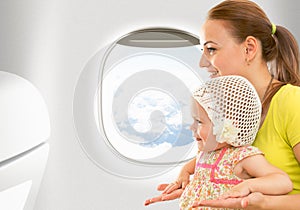 Airplane flight from inside. Woman and kid