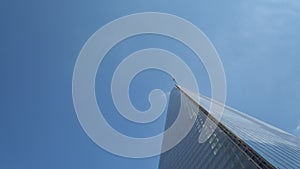 Airplane Flight Over Business Center Of Skyscrapers At London. Bottom View Of High-rise Buildings With Flying Plane In