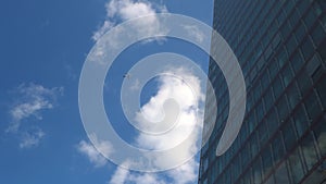 Airplane Flight Over Business Center Of Skyscrapers At London. Bottom View Of High-rise Buildings With Flying Plane In