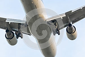 Airplane flight over, landing gear and engines view