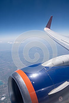 Airplane flight. Wing of an airplane flying above the clouds.