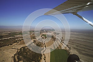 An airplane is fly on the area of Nazca Lines, and is going to take tourists over the Nazca Lines.