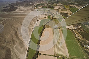 An airplane is fly on the area of Nazca Lines, and is going to take tourists over the Nazca Lines.