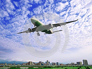 Airplane fly over buildings