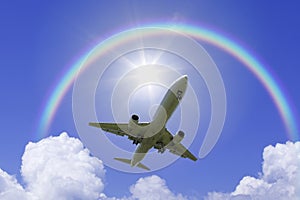 An airplane fly over the rainbow