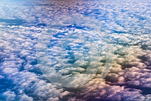 Airplane flying above clouds