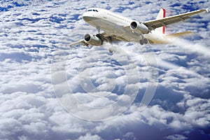 Airplane flying above the clouds - concept image with copy space