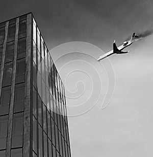 Airplane is flying above and has an engine fire