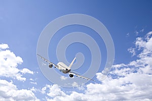 Airplane flying in the blue sky