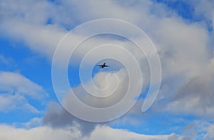 airplane flying through dark stormy clouds