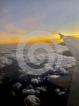 Airplane flying over beautiful clouds