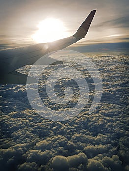 Airplane flying over the clouds